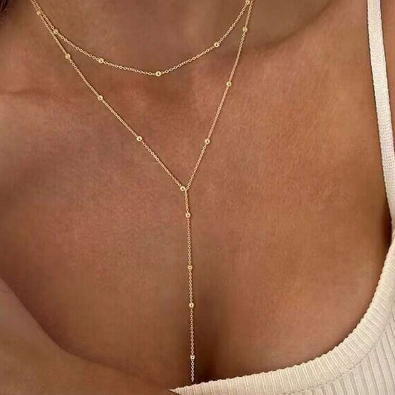 The multi-layered and stackable long pendant is a chain with tassels