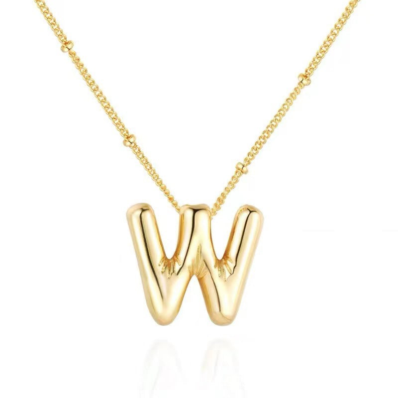 The letter pendant is available in 26 colors in 18K