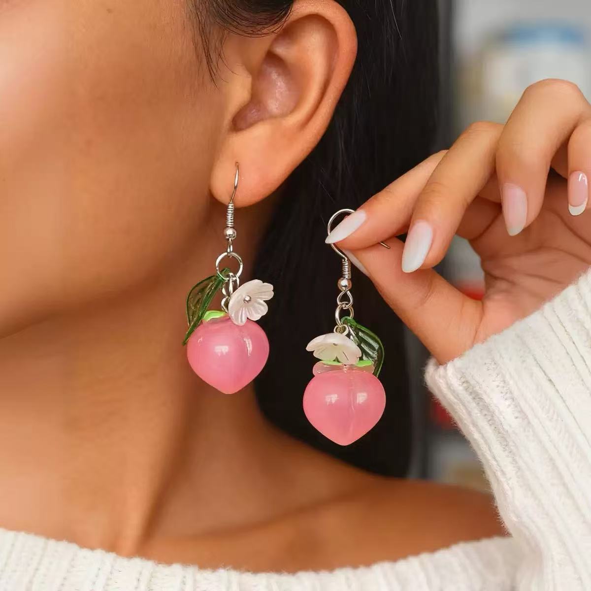 The earrings are designed with a sense of blueberry pendant ear hooks and sweet peach pendant earrings