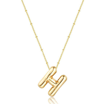 The letter pendant is available in 26 colors in 18K