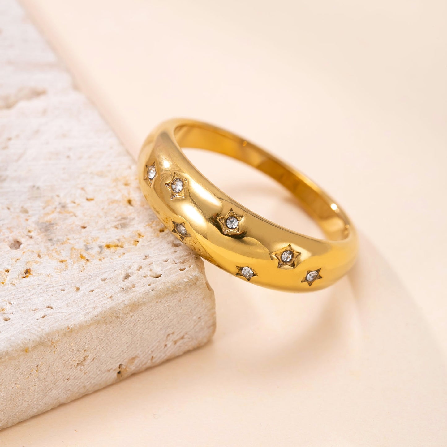 A trendy 18k cast star-studded ring for women