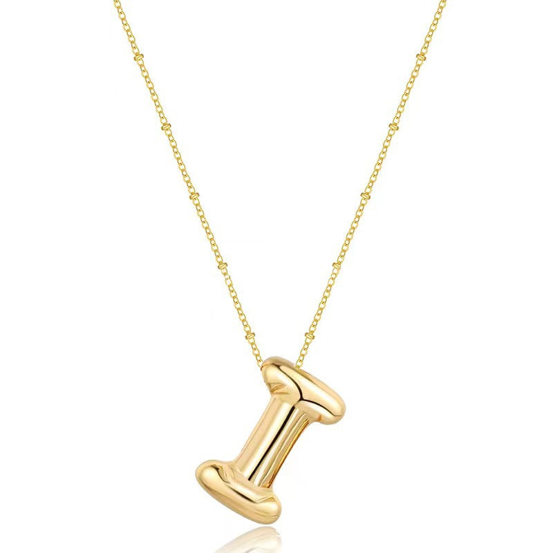 The letter pendant is available in 26 colors in 18K