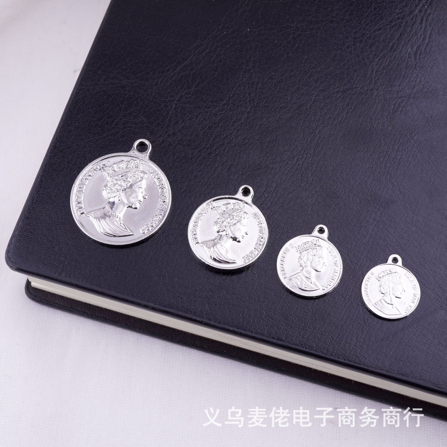 A coin pendant with a beautiful human head