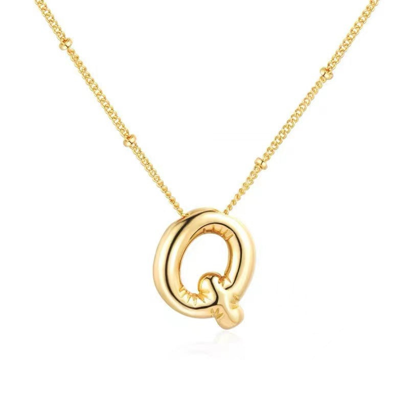 The letter pendant is available in 26 colors in 18K
