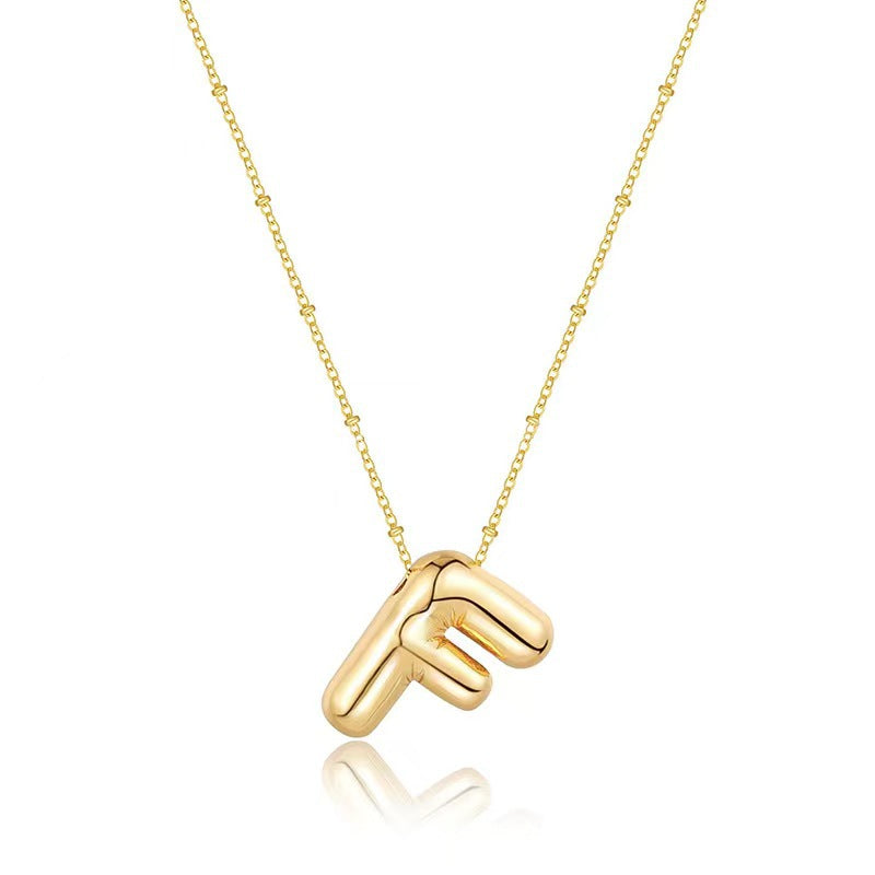 The letter pendant is available in 26 colors in 18K