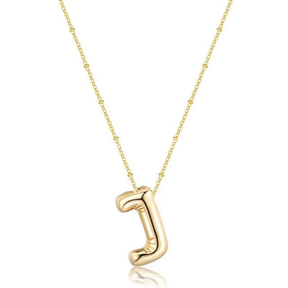 The letter pendant is available in 26 colors in 18K