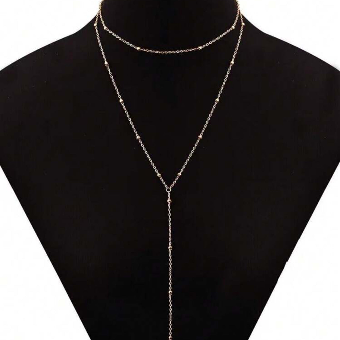 The multi-layered and stackable long pendant is a chain with tassels