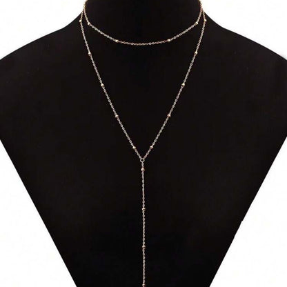 The multi-layered and stackable long pendant is a chain with tassels