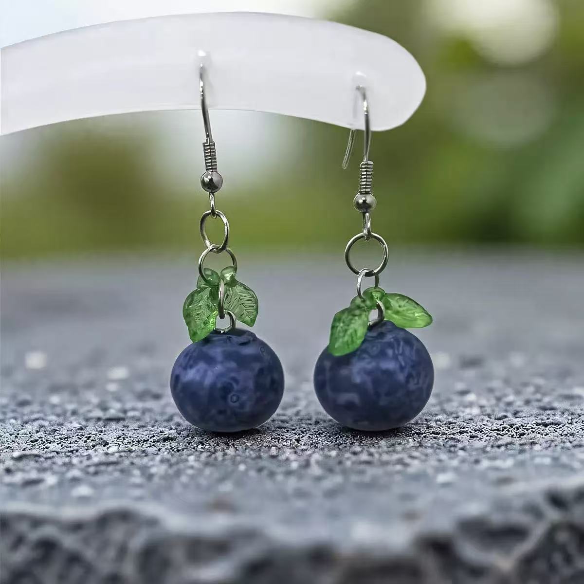 The earrings are designed with a sense of blueberry pendant ear hooks and sweet peach pendant earrings