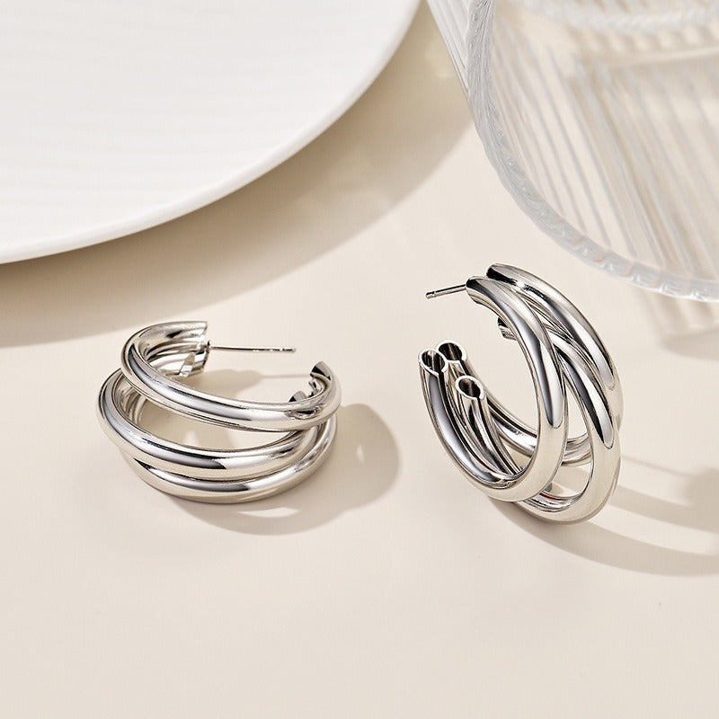 This multi-layered C-shaped earrings exude a sense of high-end sophistication and are versatile in style