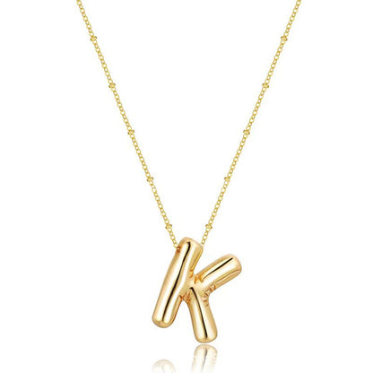 The letter pendant is available in 26 colors in 18K