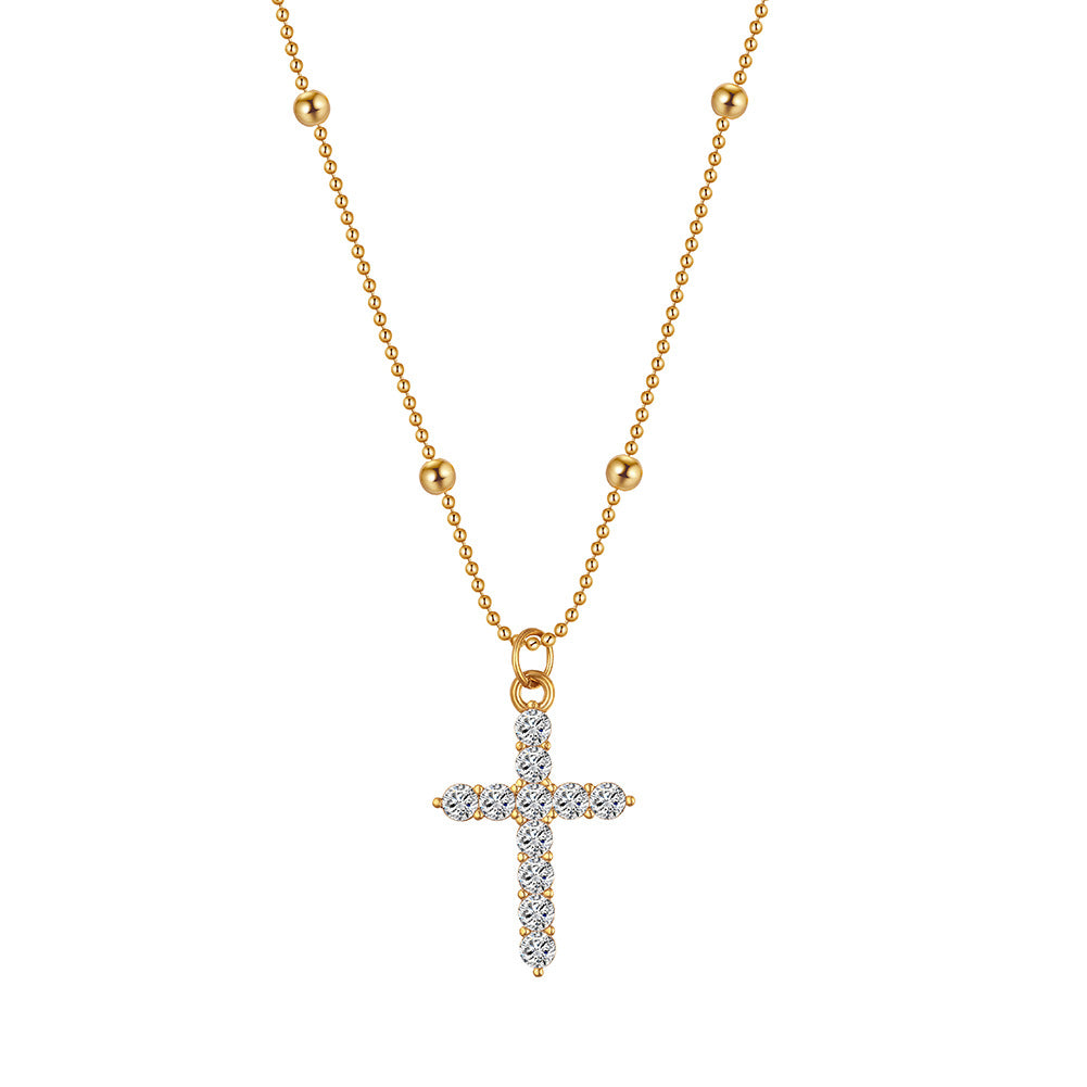 The cross-shaped pendant is set with a high-end and versatile look in yellow
