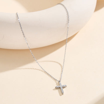 The style of a woman with a large cross chain
