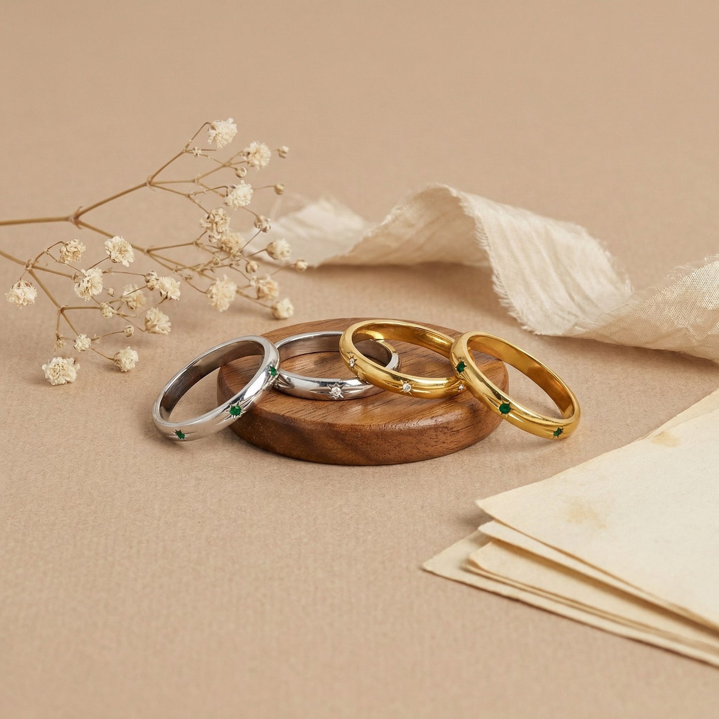 A white and green bezel ring with a silver dual-color commuting layering style