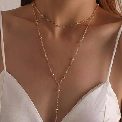 The multi-layered and stackable long pendant is a chain with tassels