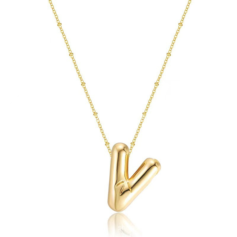 The letter pendant is available in 26 colors in 18K