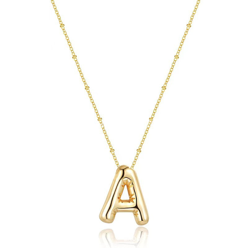 The letter pendant is available in 26 colors in 18K