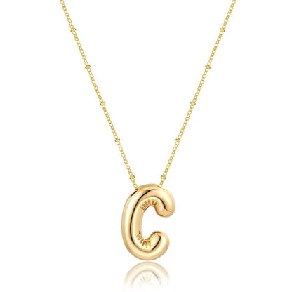 The letter pendant is available in 26 colors in 18K