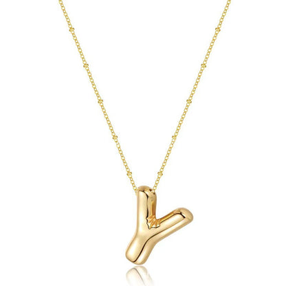 The letter pendant is available in 26 colors in 18K