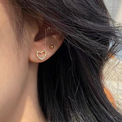 The S925 heart-shaped stud earrings with 14K plating are all, exquisite, and elegant, with a cold and sophisticated style. They are high-end earrings for women