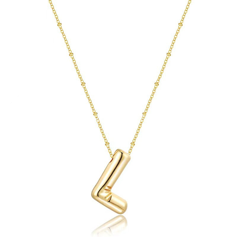 The letter pendant is available in 26 colors in 18K