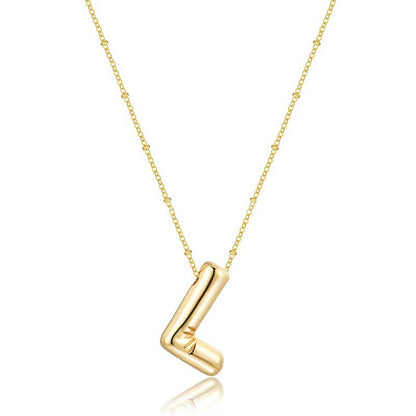 The letter pendant is available in 26 colors in 18K