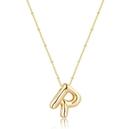 The letter pendant is available in 26 colors in 18K
