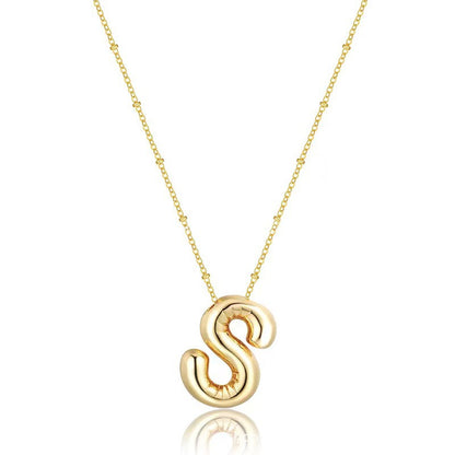 The letter pendant is available in 26 colors in 18K