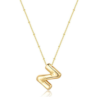 The letter pendant is available in 26 colors in 18K